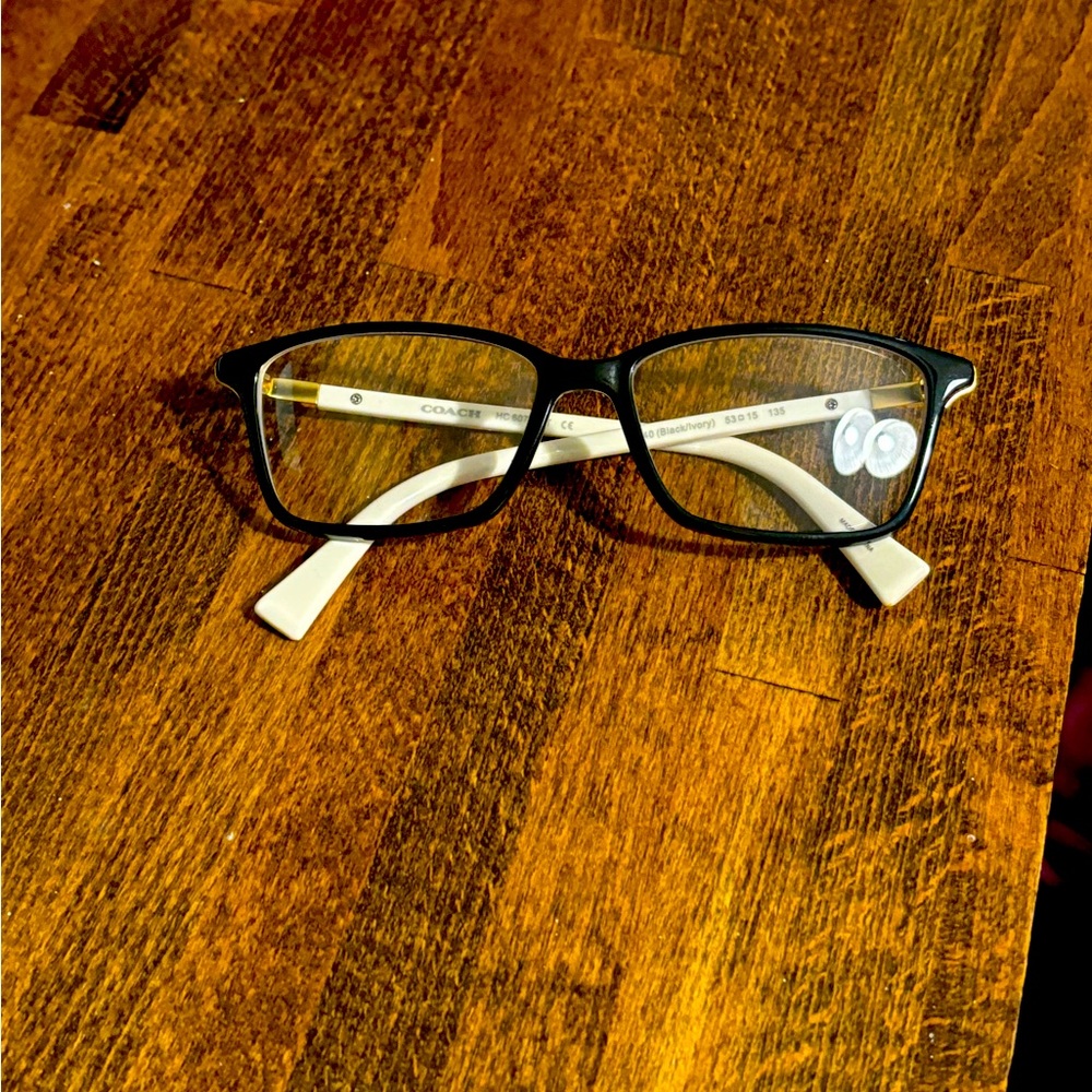 Black and white Coach frames.